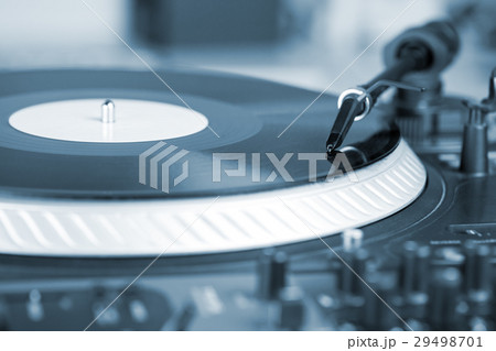 DJ needle on spinning turntable 29498701