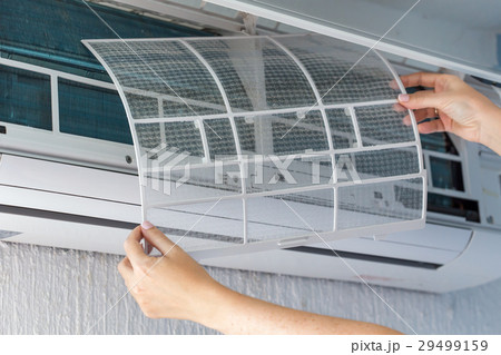 Dirty filter of air conditioner in female hands Dirty filter of air conditioner in female hands 29499159