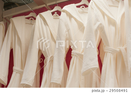 White terry robes in the closet 29508491