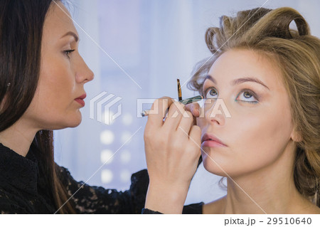 Close up shot. Professional make-up artist Close up shot. Professional make-up artist 29510640