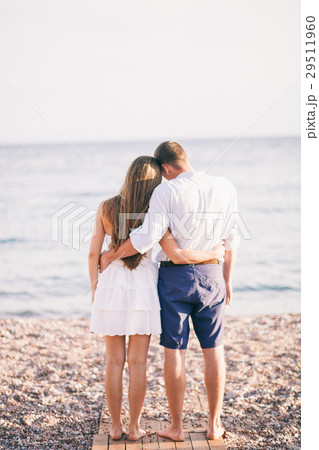couple relax on beach together 29511960
