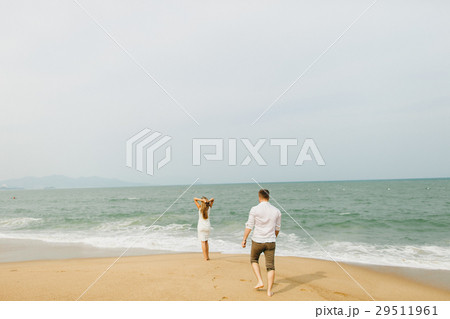 couple relax on beach together couple relax on beach together 29511961