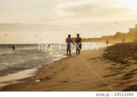 happy couple run on beach 29512009