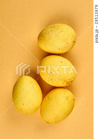 Dyed eggs on yellow background. 29513979