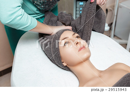 beautician prepares patient for Spa procedures in beautician prepares patient for Spa procedures in 29515943