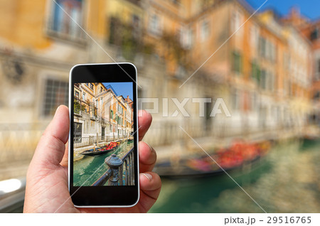 Smartphone in hand with a blank area Smartphone in hand with a blank area 29516765