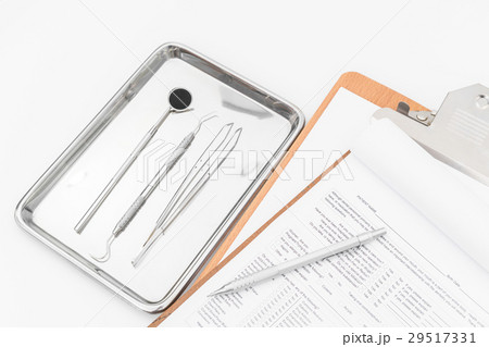 Dental tools, equipment and dental chart on white background Dental tools, equipment and dental chart on white background 29517331
