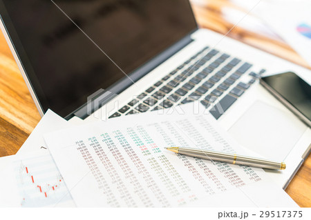 Financial charts on the table with laptop . Financial charts on the table with laptop . 29517375