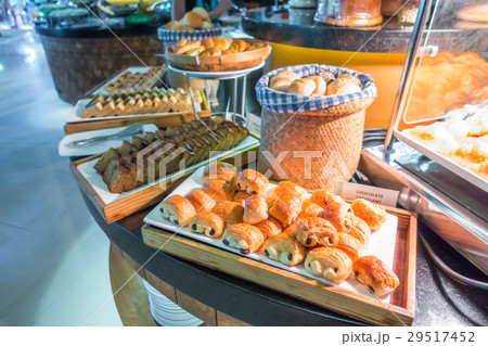 Assortment of fresh pastry on table in buffet . Assortment of fresh pastry on table in buffet . 29517452