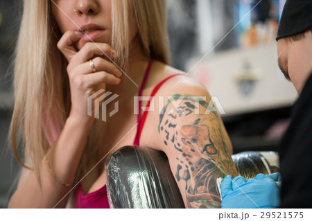 Sexy blonde posing in tattoo studio 29521575