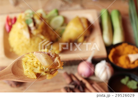 Chicken biryani with rice delicious and sauce. 29526029