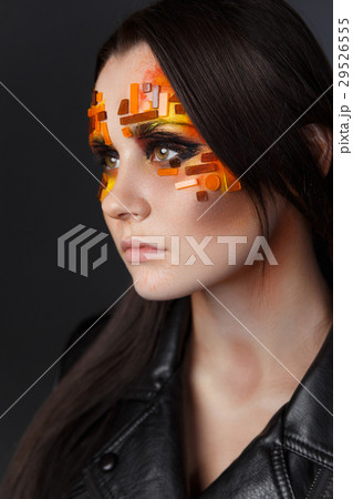Orange and Red Rhinestones on a Girl Face 29526555