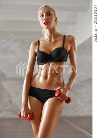 Slim, sexy,blonde, young sportswoman with athletic 29530107