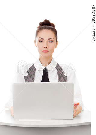 Serious businesswoman using laptop computer Serious businesswoman using laptop computer 29533087