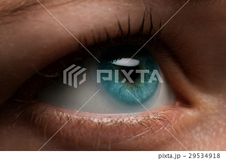 Woman eye with contact lens applying, macro.  29534918