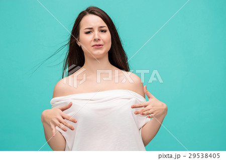 Frustrated young woman posing on blue 29538405