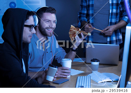 Happy joyful man enjoying his meal 29539416