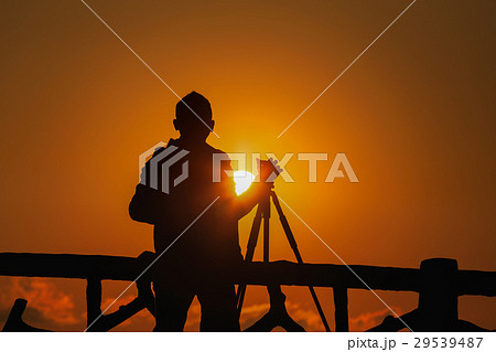 silhouette photographer with sunset 29539487