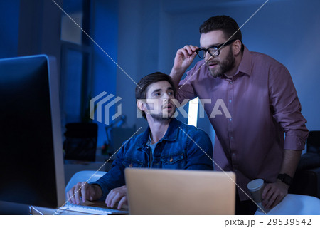 Smart bearded man fixing his glasses 29539542