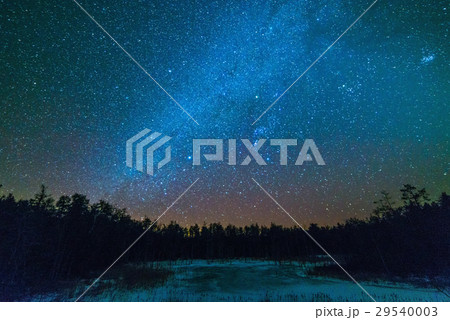 Frozen pond in winter at night with the milky way 29540003