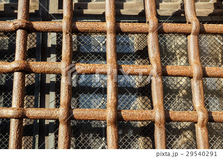 Close up iron bars or metal grating on window or Close up iron bars or metal grating on window or 29540291