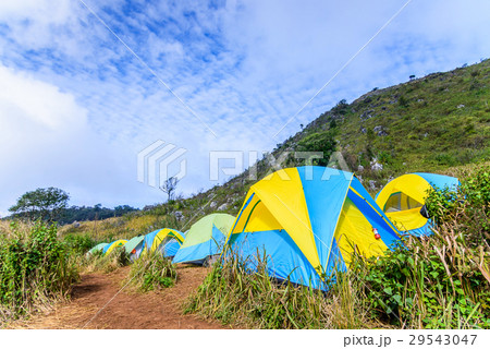 Mountain landscape with tourist tents on hill. 29543047