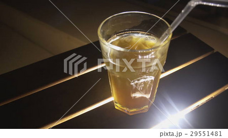 Ice coctail closeup. Rum alcohol and mango juice. 29551481