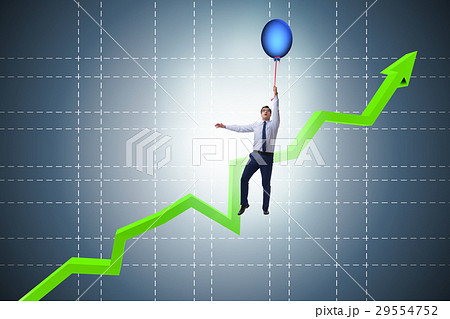 Businessman flying on hot balloon over graph Businessman flying on hot balloon over graph 29554752