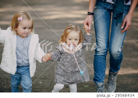 young family walking in the park 29566434
