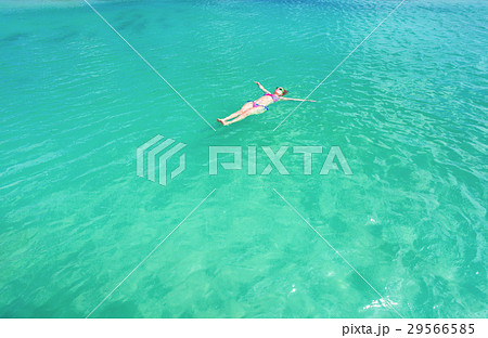 Woman floating on a back in the beautiful sea 29566585