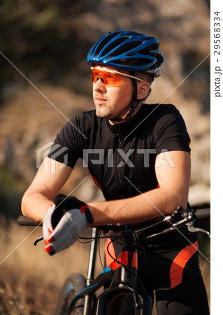 closeup portrait of professional cyclist with his closeup portrait of professional cyclist with his 29568334