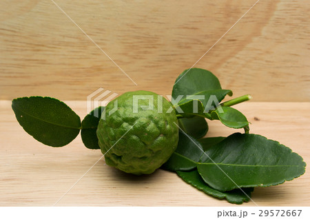 kaffir lime on a wooden background. kaffir lime on a wooden background. 29572667