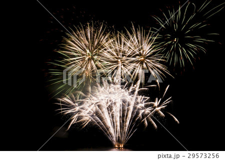 Green colorful fireworks in black background Green colorful fireworks in black background 29573256