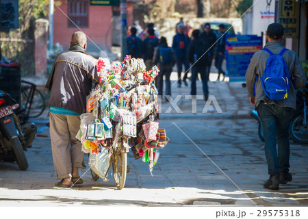 Nepalese merchant sell equipment on the bicycle  29575318