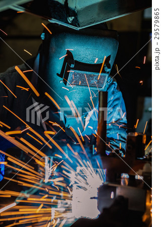 Welder is welding steel part in automotive factory Welder is welding steel part in automotive factory 29579865