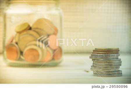Coins and glass containers.Selective focus. 29580896