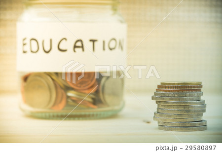 Coins and glass containers with word "Education".S 29580897