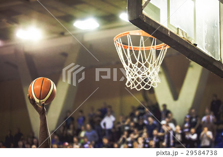 blurred crowd of people in a basketball court blurred crowd of people in a basketball court 29584738