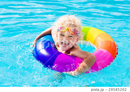 Child with toy ring in swimming pool Child with toy ring in swimming pool 29585202