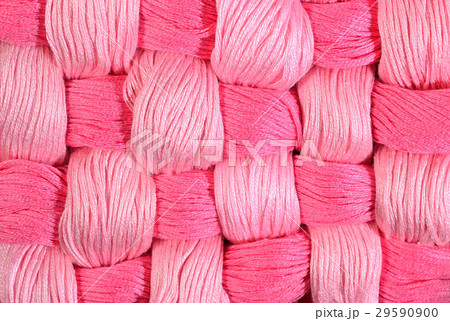 Pink twisted skeins of floss as background texture Pink twisted skeins of floss as background texture 29590900