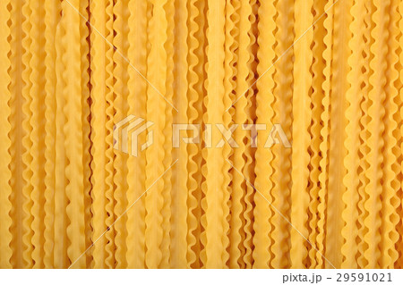 Uncooked Italian pasta mafaldine background 29591021