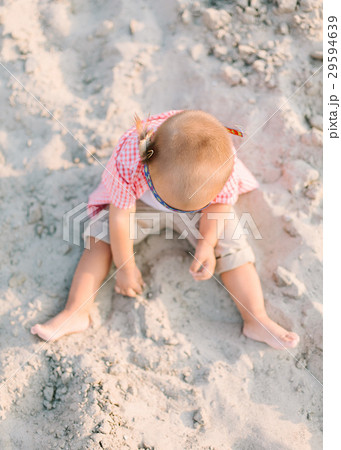 the pretty boy plays on the white sands on the 29594639
