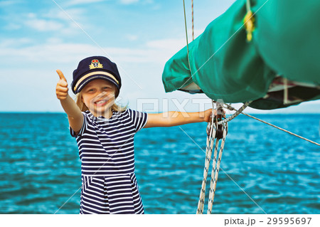 Funny baby captain on board of sailing yacht 29595697