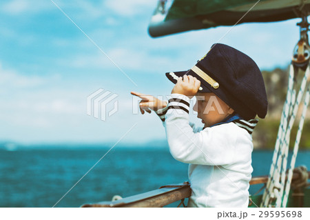 Funny baby captain on board of sailing yacht 29595698