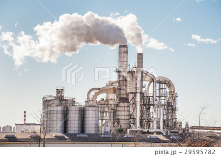 Chimneys and silos of a factory. 29595782