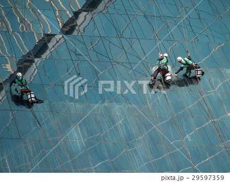 men cleaning glass building men cleaning glass building 29597359