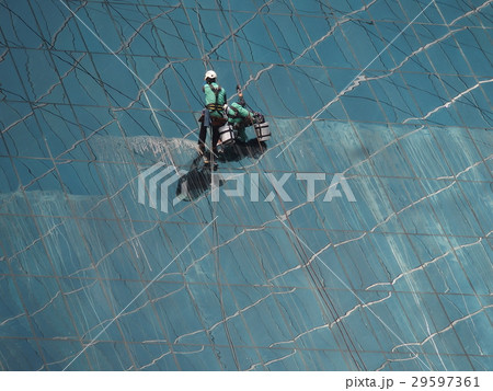 men cleaning glass building men cleaning glass building 29597361