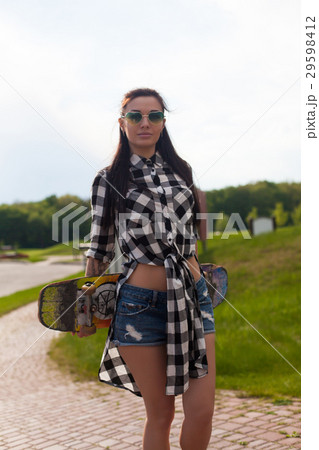 The woman holds a skate The woman holds a skate 29598412