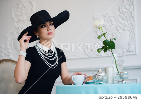 Woman in hat, much like the famous actress 29598648