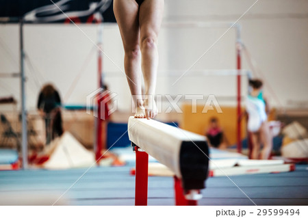 female exercises on balance beam 29599494